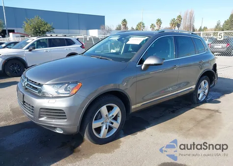 2014 Volkswagen Touareg Tdi Lux z USA, uszkodzony, nr VIN WVGEP9BP7ED013971